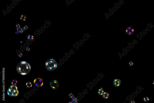 Soap bubbles isolated on a black background © Nikolay