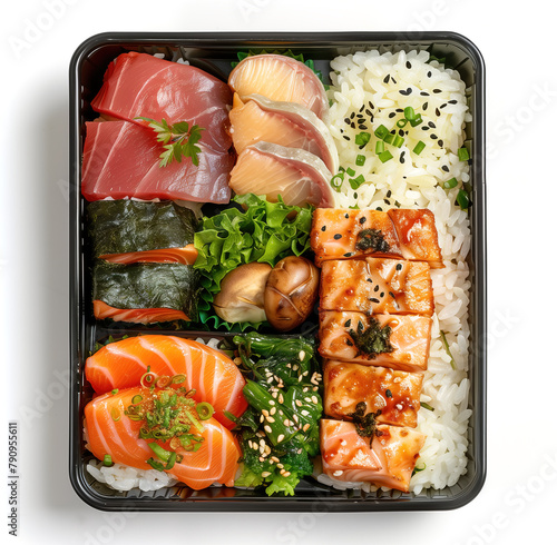 Take-away box with rice and a variety of seafood, sushi, and green vegetables. Asian takeout food in a black plastic container, isolated on white background. Top view.