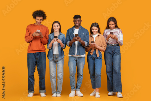 Group of friends focused on their smartphones