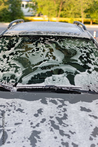 the windshield of a car is covered in foam
