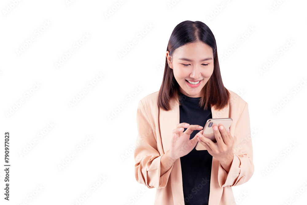 Joyful young woman texting on her smartphone, engaged and smiling, wearing a beige coat on a white background.
Joyful young woman texting on her smartphone, engaged and smiling, wearing a beige coat on a white background.
