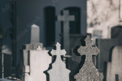 Amidst the quiet serenity of the cemetery, rows of tombstones and crosses stand as solemn monuments to the departed, a timeless symbol of remembrance and honor.