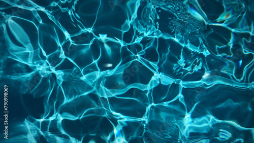 Animated transparent clean blue swimming pool water surface with waves and sunlight glitters. Water background light reflection  pool bottom  moving liquid plastic smooth. 8k wallpaper 4k screensaver.