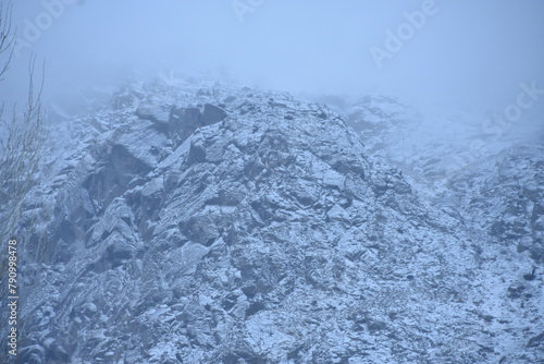 Misty mountain slope with fresh snowfall © Sohail