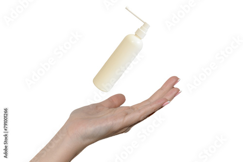 White container with antiseptic. Hand of a white young girl.