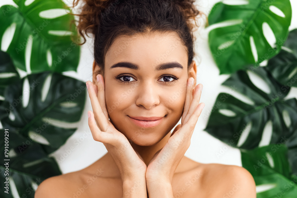 Cheerful african american woman with hands on cheeks Cheerful african american woman with hands on cheeks