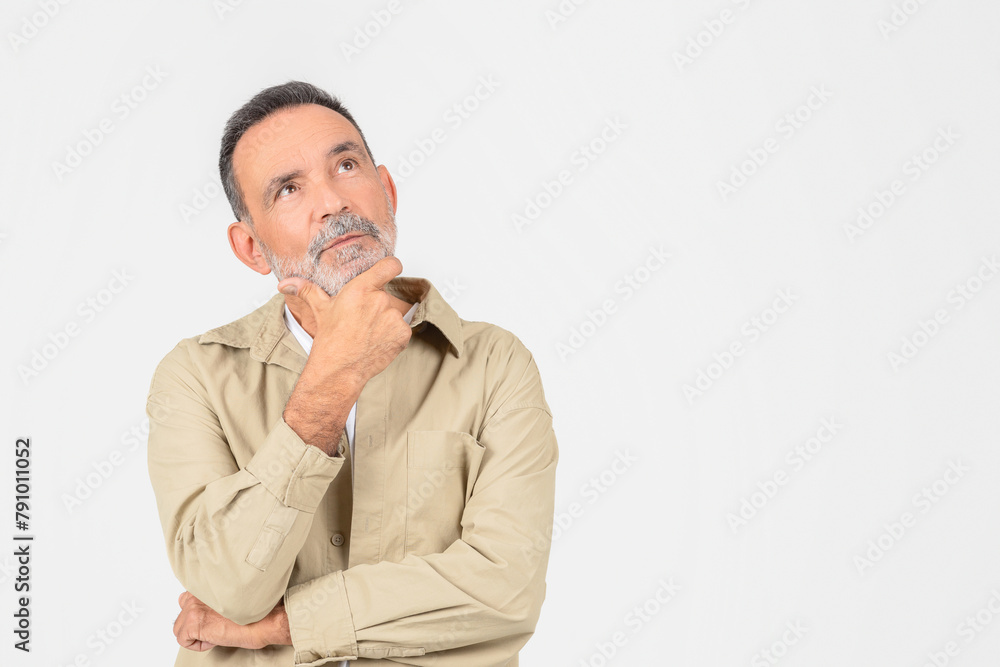 Pensive senior man with thoughtful expression on white background Pensive senior man with thoughtful expression on white background