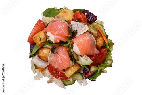 Delicious juicy salad with salmon, tomatoes, cucumber, herbs, pumpkin seeds