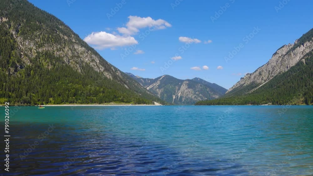 Alpine lake Heiterwang in Austria an environment of mountains and the woods, UHD fps25 Alpine lake Heiterwang in Austria an environment of mountains and the woods, UHD fps25