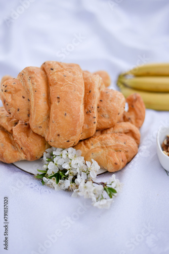 croissant and blossom on picnic