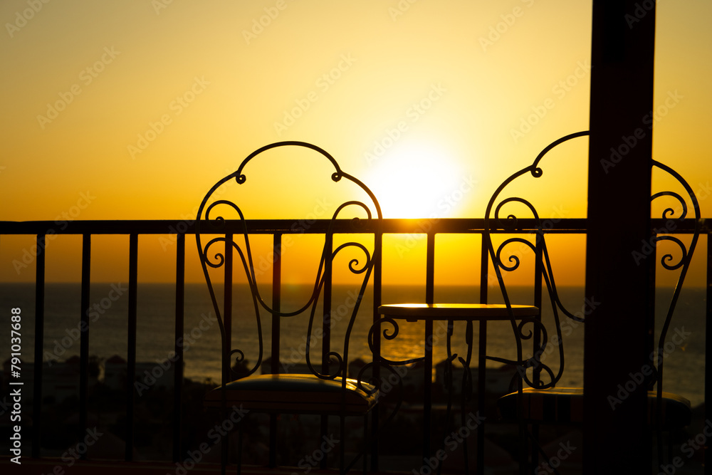 A Very beautiful silhouette of chairs on the seashore of the sea A Very beautiful silhouette of chairs on the seashore of the sea