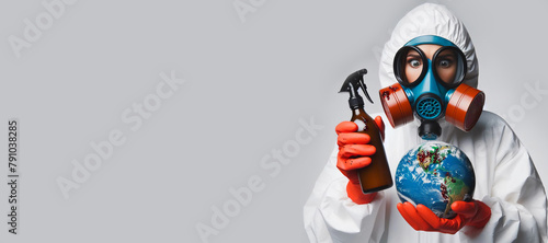 Рrofessional disinfector man in a protective suit holds a spray bottle. photo