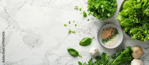 Fresh uncooked leafy greens, natural vegetables, and grains on a neutral-colored marble kitchen counter, with space for text. Emphasizing clean eating, health, veganism, vegetarianism, detoxification,