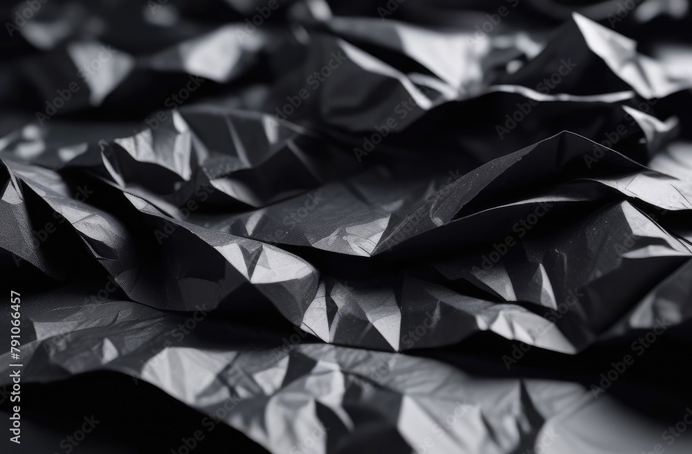 Black crumpled paper. Colored paper background. Black crumpled paper. Colored paper background.