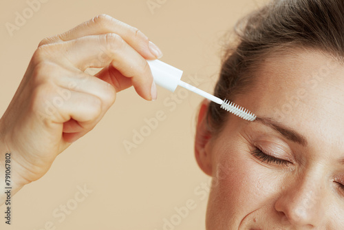 Closeup on woman with brow brush