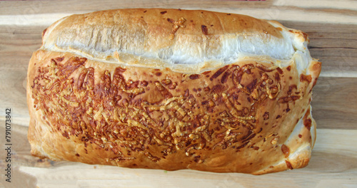 Stuffed puff pastry with asparagus, parmesan, wild garlic and 
pieces of meat,
 photo