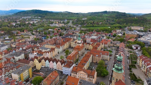 Bird's-eye view captures Jelenia Góra's bustling market square and 18th-century town hall. © Grzegorz