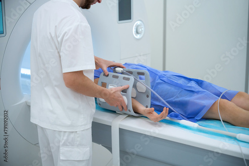 Εκτύπωση καμβά Radiographer preparing client for magnetic resonance imaging of lower arm