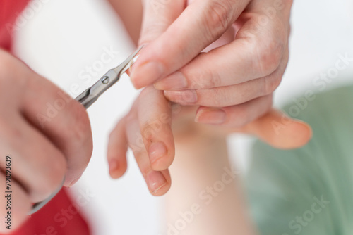 Mom cutting baby s nails. close-up. Selected Focus