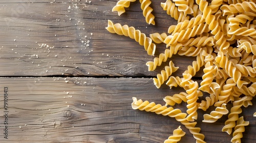 fussili pasta on wooden background photo