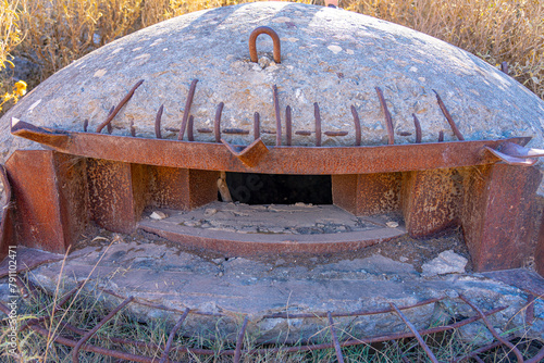 Exterior of Albanian characteristic round dome bunker. photo