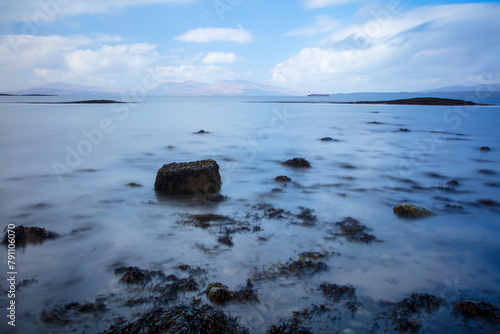 View from Ganavan Sands with the Isle of Mull and the Isle of Lismore in the distance. Oban, Argyll and Bute, Scotland, UK. photo