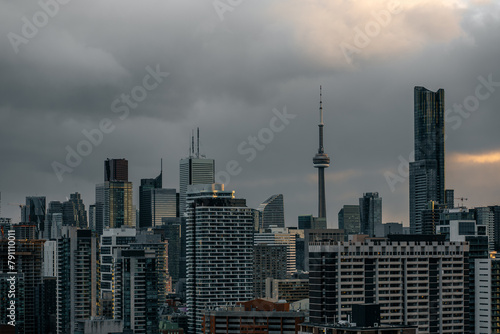 Toronto city downtown skyline, clouds over CN Tower and skyscrapers of financial district Canada