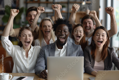 Group of People Sitting Around Laptop Computer