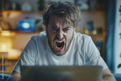 Frustrated Man Experiencing Computer Problems Indoors