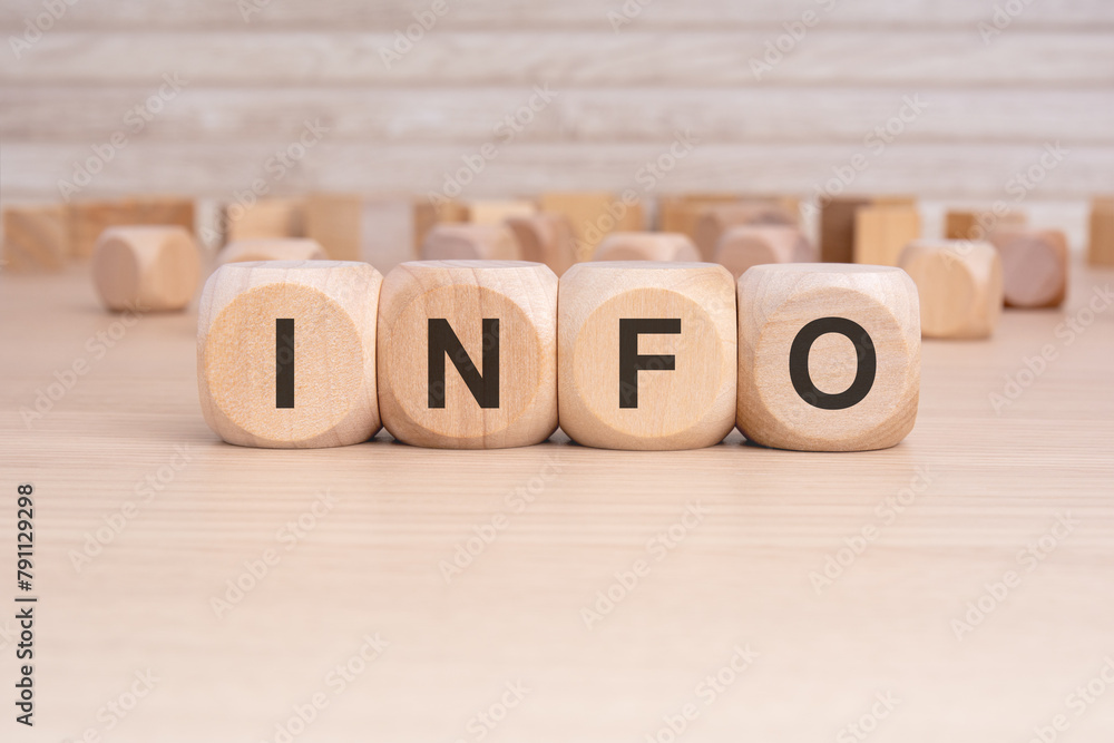 the word INFO is elegantly displayed on a beige hardwood rectangle block the word INFO is elegantly displayed on a beige hardwood rectangle block