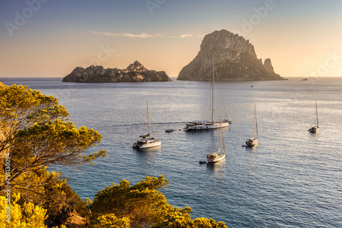 Panoramic view at sunset of Es Vedra island in Eivissa in the mediterranean sea. Spain, Europe. photo