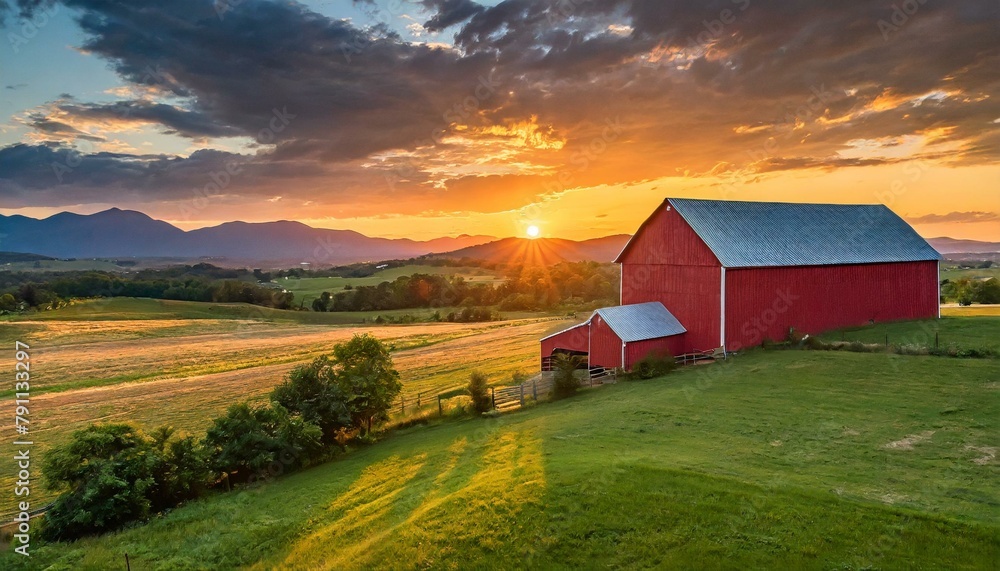 Summer sunset with a red barn in rural 