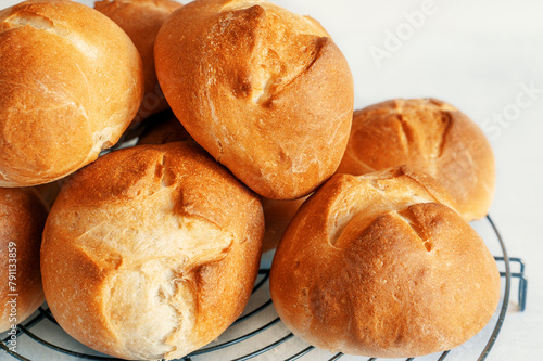 homemade buns. Homemade buns on wood board with wheat ears. Homemade Dinner Rolls, selective focus