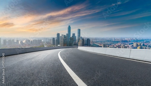 asphalt highway road and city skyline background