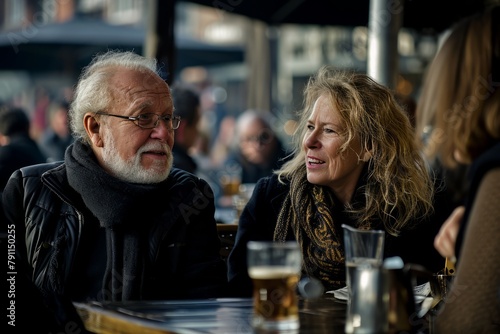 Couple sitting at a table in a pub or restaurant and talking