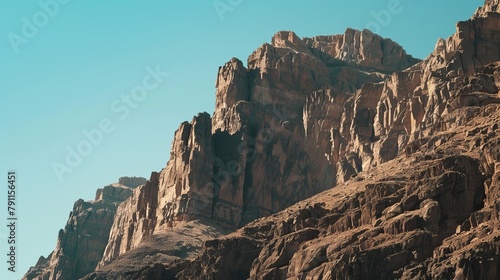 Dramatic Mountain Cliffs Jutting into Clear Blue Sky