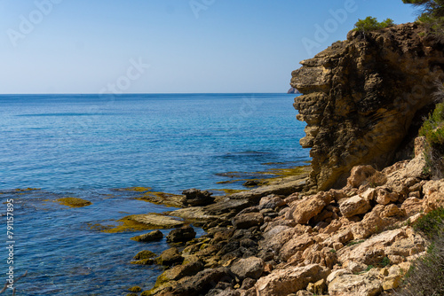 landscape of cliffs near Cala de Pinets Beach in Ecological walk Benissa Calp, province of Alicante, Spain. Copy space background, concept lonely vacations on the coast. High quality photo photo