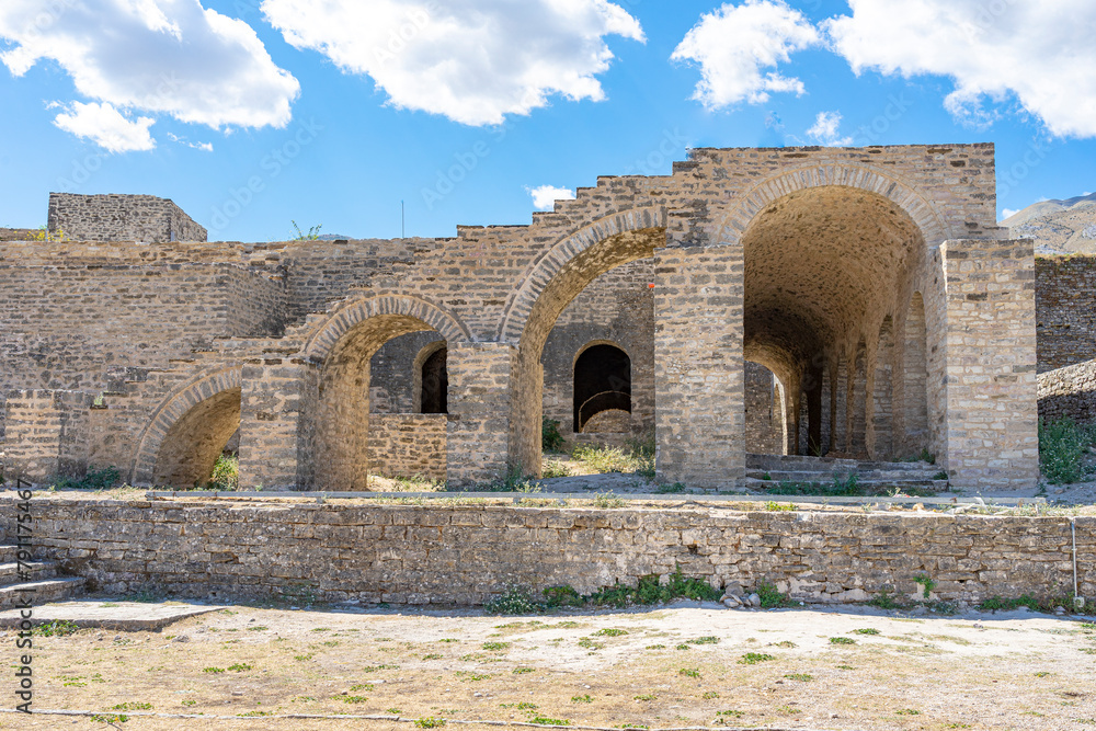 Part of ruins of arch-shaped structure of Ottoman architecture at Gjirokaster castle in Albania Part of ruins of arch-shaped structure of Ottoman architecture at Gjirokaster castle in Albania