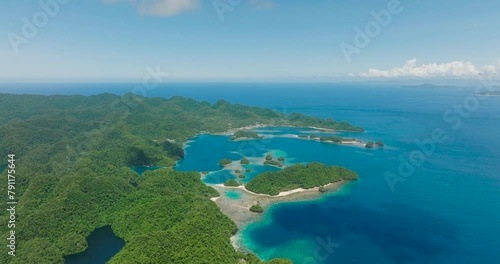 Beautiful tropical beach and blue sea. Transparent turquoise ocean water surface. Seascape. Bucas Grande Island. Mindanao, Philippines. photo