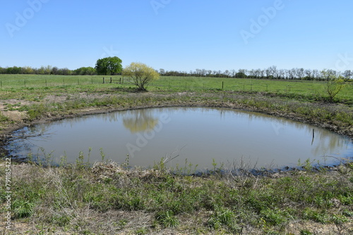 Tableau sur toile Pond in a Farm Field