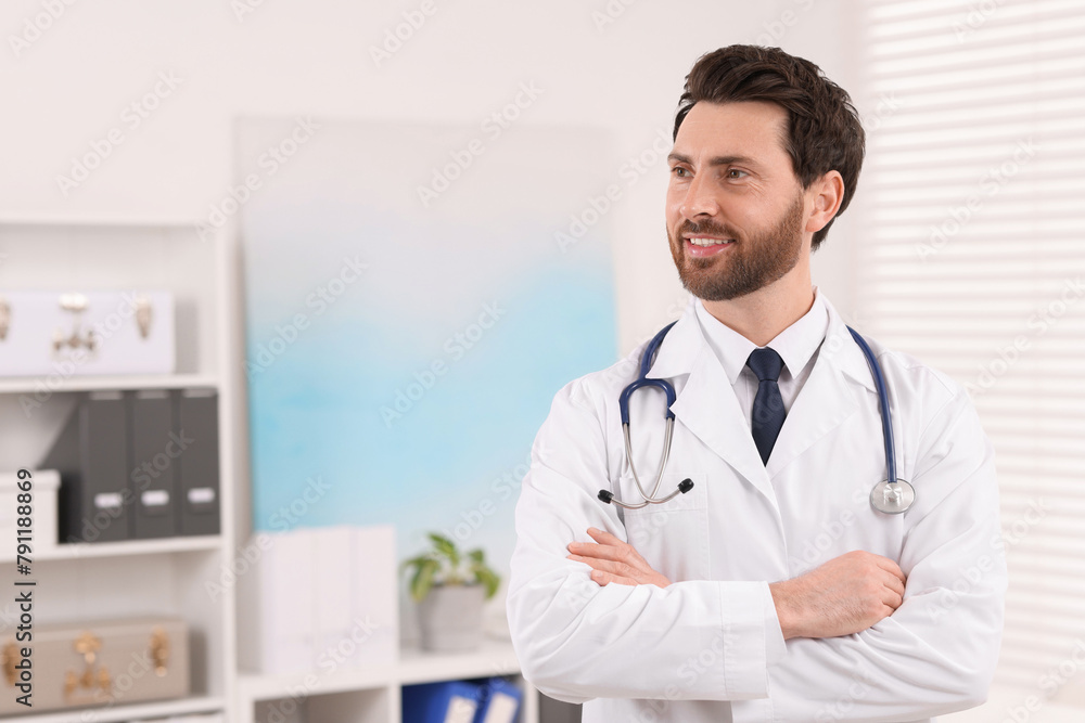 Medical consultant with stethoscope in clinic, space for text Medical consultant with stethoscope in clinic, space for text