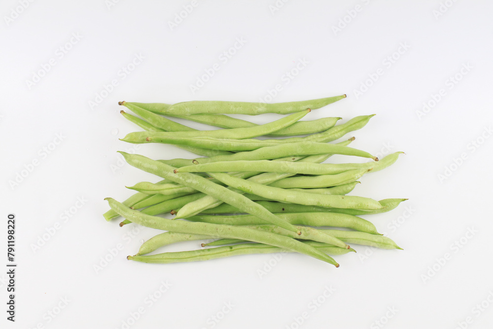 Green beans on white background. Healthy vegetarian food Natural products. Fresh harvest bean organic meal Green beans on white background. Healthy vegetarian food Natural products. Fresh harvest bean organic meal