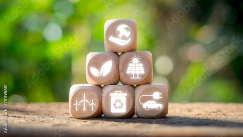 Environment concept, Wooden block on desk with earth, tree, solar energy, wind energy, recycle and ecologyicon on virtual screen. photo