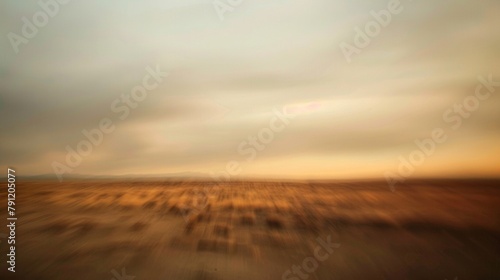 The blurred horizon in this defocused background invites the imagination to wander and conjure up visions of desert adventures with the muted colors creating a sense of mystery and . photo