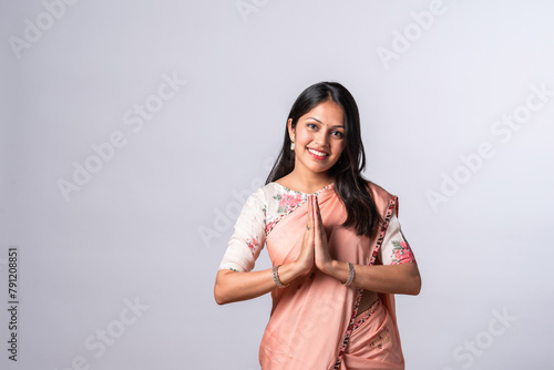 Obraz na płótnie Indian pretty young woman posing with namaskara, namaste or welcome posture