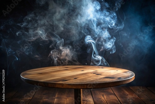 Empty old circular wooden table with smoke float up on dark background