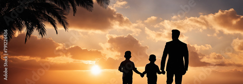Loving father walking side by side with sons holding hands in sunset. Happy fathers day. photo