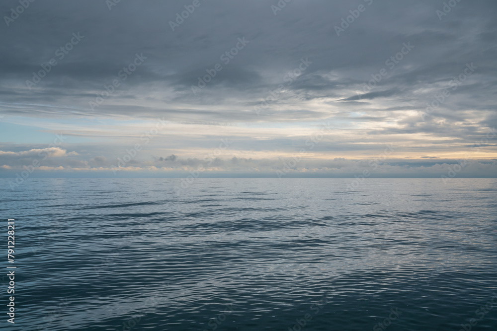 Fototapeta premium View of the Black Sea on the coast of Sochi against the sunset sky, Sochi, Krasnodar Krai, Russia