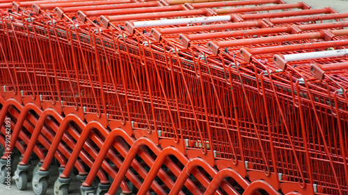 Red shopping carts connected in a row