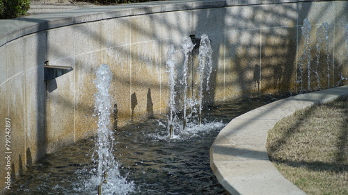 Rising water stream from an outdoor park fountain structure